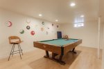 Pool table & more in the large basement game room 